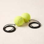 Two spare training balls with cords