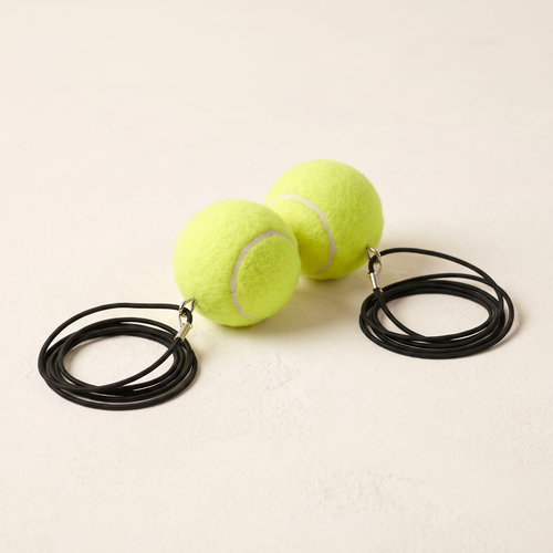 Two spare training balls with cords